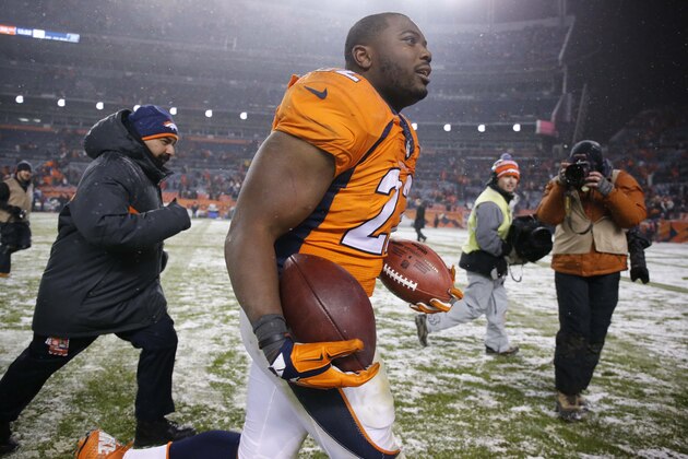 Denver Broncos running back C.J. Anderson (22) runs off the field after an NFL football game against the New England Patriots, Sunday, Nov. 29, 2015, in Denver. The Broncos defeated the Patriots 30-24. (AP Photo/Jack Dempsey)