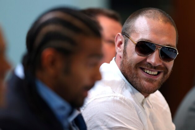 LONDON, ENGLAND - JULY 11:  Tyson Fury (R) speaks beside David Haye during a press conference to announce their upcoming  title fight on July 11, 2013 in London, England.  (Photo by Clive Rose/Getty Images)