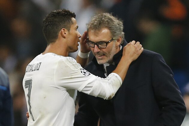 Real Madrid's Cristiano Ronaldo, left, talks with PSG headcoach Laurent Blanc after their Group stage of Champions League Group A soccer match at the Santiago Bernabeu stadium in Madrid, Spain, Tuesday, Nov.3, 2015. Ream Madridd won 1-0. (AP Photo/Daniel Ochoa de Olza)