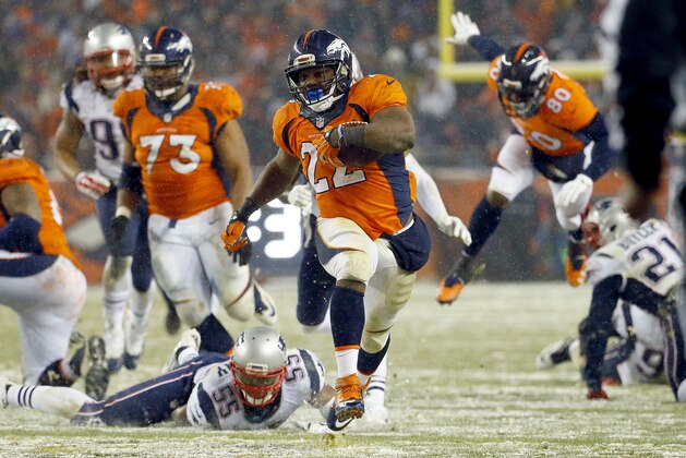 Denver Broncos running back C.J. Anderson (22) breaks free for the game-winning touchdown against the New England Patriots during overtime of an NFL football game, Sunday, Nov. 29, 2015, in Denver. The Broncos defeated the Patriots 30-24. (AP Photo/Jack Dempsey)