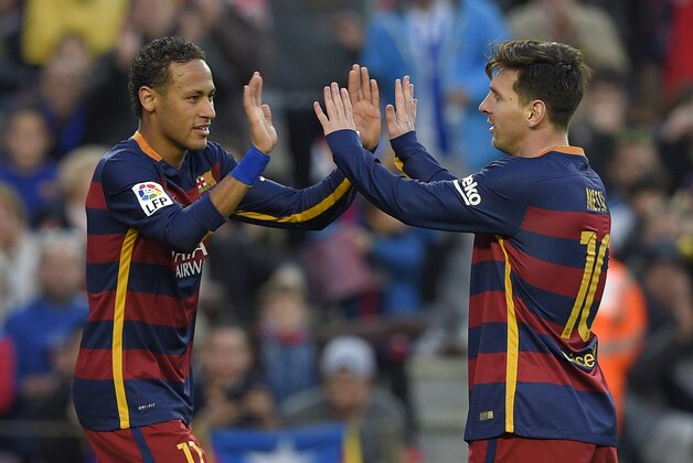 Barcelona's Brazilian forward Neymar (L) celebrates with Barcelona's Argentinian forward Lionel Messi after scoring their third goal during the Spanish league football match FC Barcelona vs Real Sociedad de Futbol at the Camp Nou stadium in Barcelona on November 28, 2015. AFP PHOTO/ LLUIS GENE / AFP / LLUIS GENE        (Photo credit should read LLUIS GENE/AFP/Getty Images)