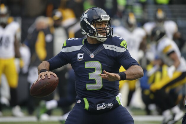 Seattle Seahawks quarterback Russell Wilson throws against the Pittsburgh Steelers in the first half of an NFL football game, Sunday, Nov. 29, 2015, in Seattle. (AP Photo/Ted S. Warren)