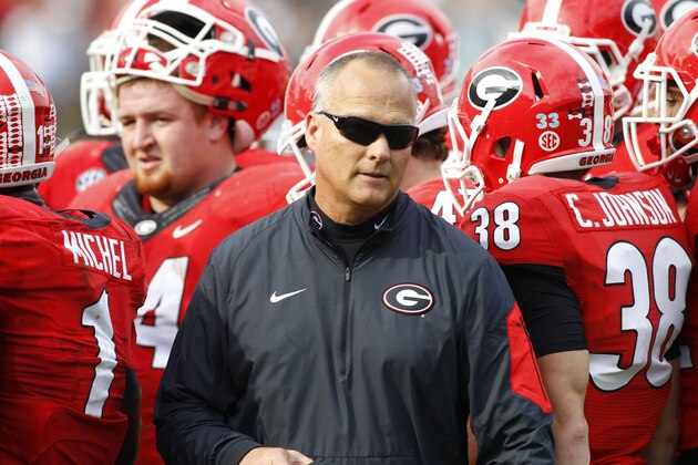 Georgia head coach walks out of a huddle during a timeout in the second half of an NCAA college football game against Georgia Tech on Saturday, Nov. 28, 2015, in Atlanta, Ga. Georgia won 13-7. (AP Photo/Brett Davis) Georgia head coach walks out of a huddle during a timeout in the second half of an NCAA college football game against Georgia Tech on Saturday, Nov. 28, 2015, in Atlanta, Ga. Georgia won 13-7. (AP Photo/Brett Davis)