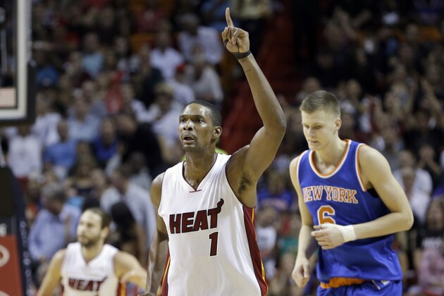 Miami Heat forward Chris Bosh (1) celebrates after scoring against the New York Knicks  during the first half of an NBA basketball game, Monday, Nov. 23, 2015, in Miami. The Heat won 95-78. (AP Photo/Alan Diaz)