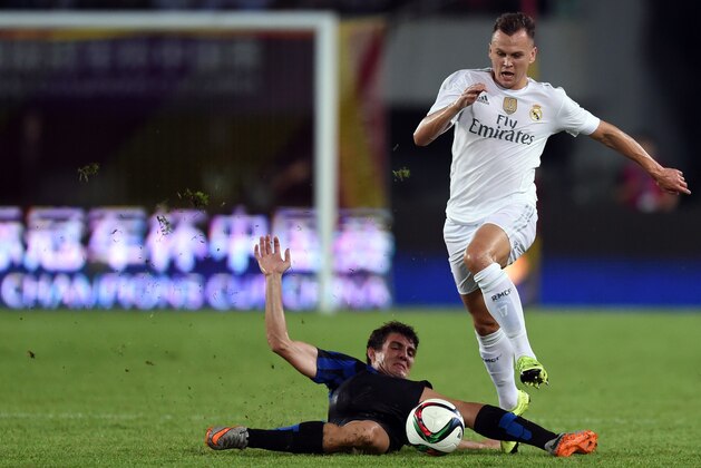 Real Madrid's Russian midfielder Denis Cheryshev (R) and Inter's Croatians midfielder Mateo Kovacic vie for the ball  during the International Champions Cup football match between Inter Milan and Real Madrid in Guangzhou on July 27, 2015. AFP PHOTO / JOHANNES EISELE        (Photo credit should read JOHANNES EISELE/AFP/Getty Images)