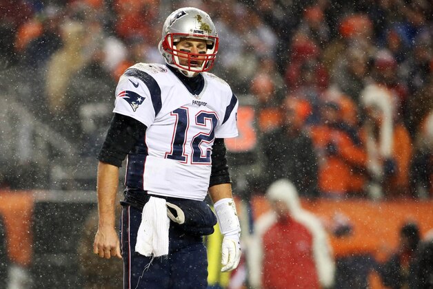 Nov 29, 2015; Denver, CO, USA;New England Patriots quarterback Tom Brady (12)  reacts during the second half against the Denver Broncos at Sports Authority Field at Mile High. The Broncos won 30-24. Mandatory Credit: Chris Humphreys-USA TODAY Sports
