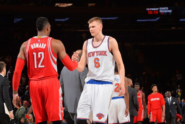 NEW YORK,NY - NOVEMBER 29: Kristaps Porzingis #6 of the New York Knicks shakes hands with Dwight Howard #12 of the Houston Rockets at Madison Square Garden on November 29, 2015 in New York,New York NOTE TO USER: User expressly acknowledges and agrees that, by downloading and/or using this Photograph, user is consenting to the terms and conditions of the Getty Images License Agreement. Mandatory Copyright Notice: Copyright 2015 NBAE (Photo by Jesse D. Garrabrant/NBAE via Getty Images)