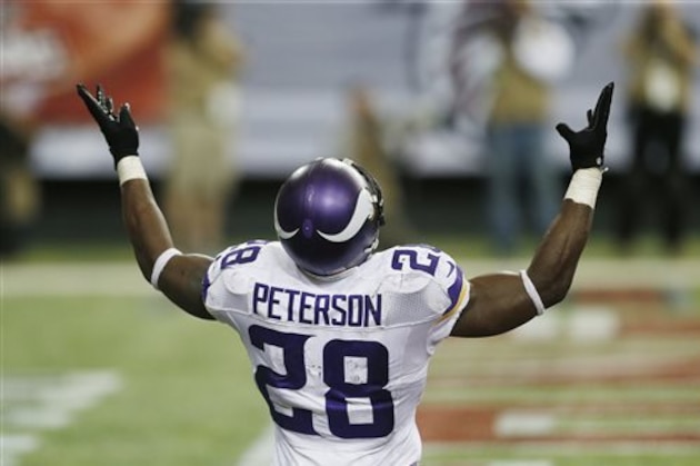 Minnesota Vikings running back Adrian Peterson (28) celebrates his touchdown against the Atlanta Falcons during the second half of an NFL football game, Sunday, Nov. 29, 2015, in Atlanta. (AP Photo/Butch Dill)