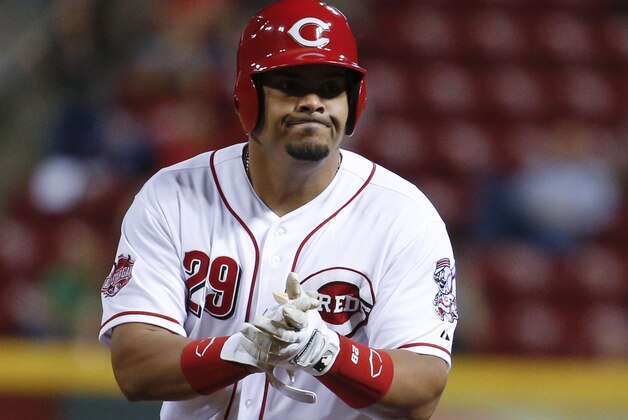 Cincinnati Reds' Brayan Pena reacts after hitting a two-run single off Los Angeles Dodgers starting pitcher Brett Anderson sueinf the seventh inning of a baseball game, Wednesday, Aug. 26, 2015, in Cincinnati. (AP Photo/John Minchillo)