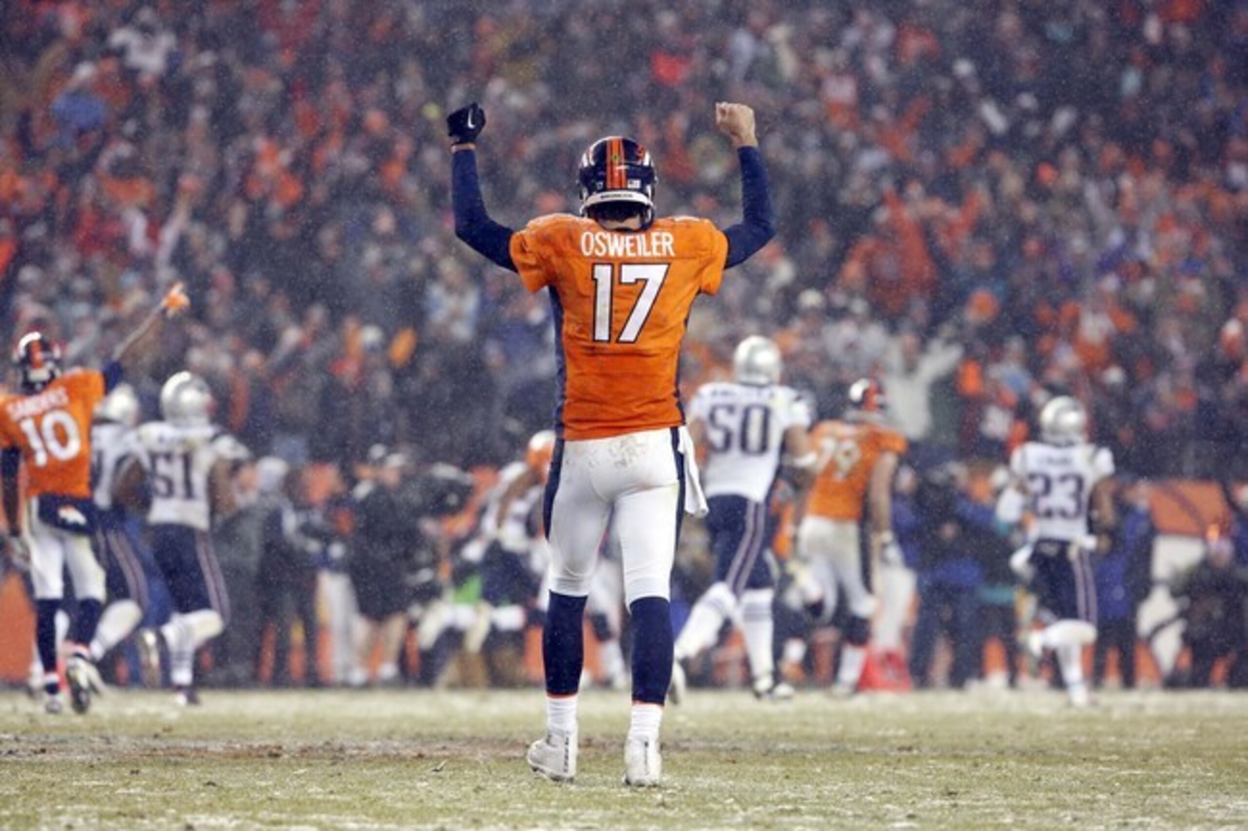 Denver Broncos quarterback Brock Osweiler (17) celebrates the game winning touchdown during overtime of an NFL football game against the New England Patriots, Sunday, Nov. 29, 2015, in Denver. The Broncos defeated the Patriots 30-24. (AP Photo/Joe Mahoney)