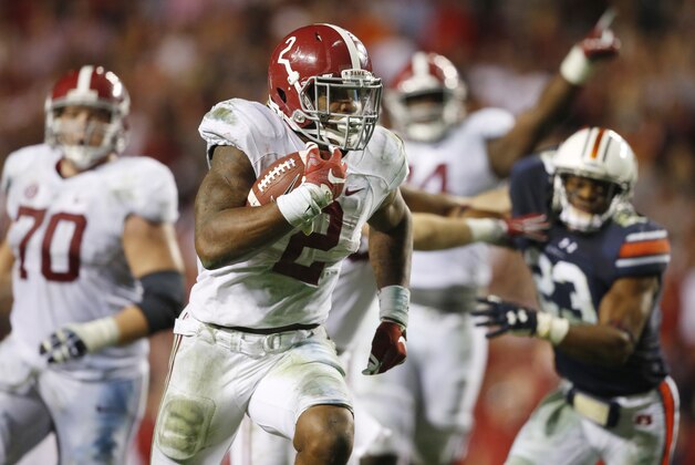Alabama running back Derrick Henry (2) scores a touchdown in the second half of an NCAA college football game against Auburn, Saturday, Nov. 28, 2015, in Auburn, Ala. Alabama won 29-13. (AP Photo/Gerald Herbert)