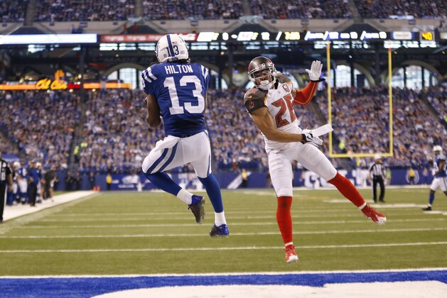 Indianapolis Colts wide receiver T.Y. Hilton (13) makes a catch over Tampa Bay Buccaneers cornerback Sterling Moore (26) for a touchdown during the second half of an NFL football game in Indianapolis, Sunday, Nov. 29, 2015. (AP Photo/AJ Mast)