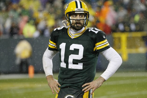Green Bay Packers' Aaron Rodgers walks off the field after failing to complete on fourth down in the final seconds of an NFL football game against the Chicago Bears Thursday, Nov. 26, 2015, in Green Bay, Wis. The Bears won 17-13. (AP Photo/Morry Gash)