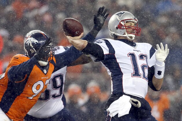 New England Patriots quarterback Tom Brady (12) throws against the Denver Broncos during the second half of an NFL football game, Sunday, Nov. 29, 2015, in Denver. (AP Photo/Joe Mahoney)