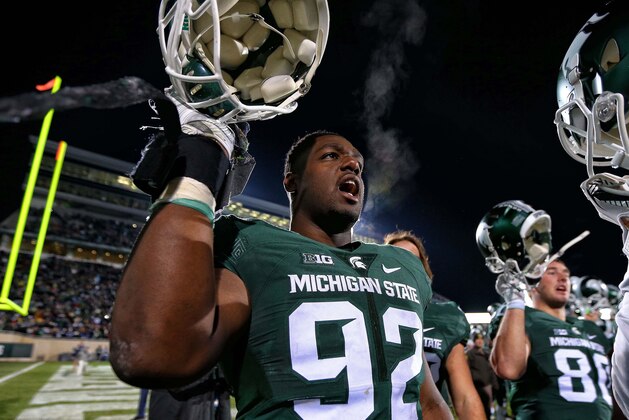 Nov 28, 2015; East Lansing, MI, USA; Michigan State Spartans defensive lineman Joel Heath (92) celebrates the win over Penn State Nittany Lions after a game at Spartan Stadium. Mandatory Credit: Mike Carter-USA TODAY Sports