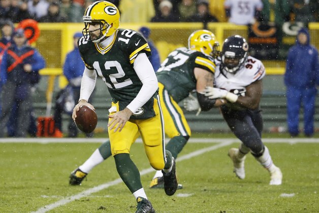 Green Bay Packers' Aaron Rodgers runs during the second half of an NFL football game against the Chicago Bears Thursday, Nov. 26, 2015, in Green Bay, Wis. (AP Photo/Morry Gash)