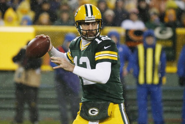 Green Bay Packers' Aaron Rodgers drops back to pass during the first half of an NFL football game against the Chicago Bears Thursday, Nov. 26, 2015, in Green Bay, Wis. (AP Photo/Mike Roemer)