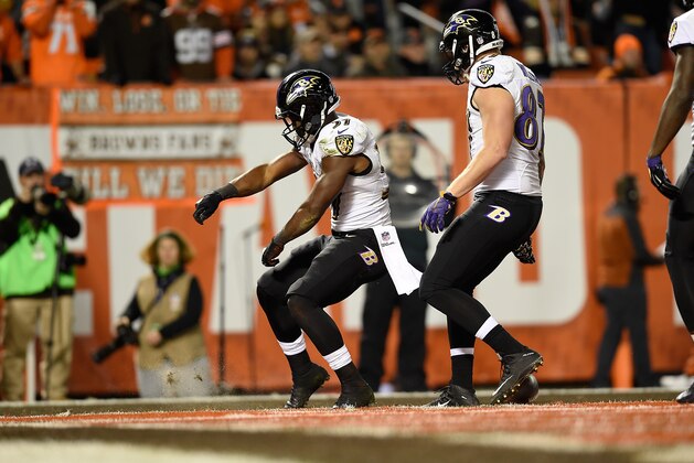 CLEVELAND, OH - NOVEMBER 30:  Javorius Allen #37 celebrates his touchdown with Maxx Williams #87 of the Baltimore Ravens during the second quarter against the Cleveland Browns at FirstEnergy Stadium on November 30, 2015 in Cleveland, Ohio.  (Photo by Jason Miller/Getty Images)