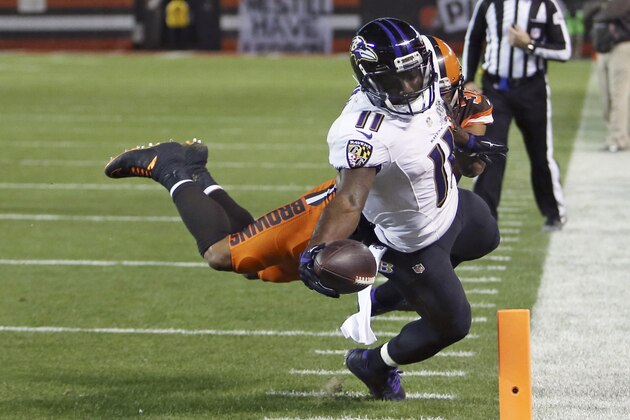 Baltimore Ravens wide receiver Kamar Aiken (11) sores after a reception in the second half of an NFL football game against the Cleveland Browns, Monday, Nov. 30, 2015, in Cleveland. (AP Photo/Ron Schwane)