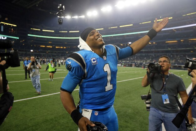Carolina Panthers' Cam Newton (1) acknowledges fans after their NFL football game against the Dallas Cowboys, Thursday, Nov. 26, 2015, in Arlington, Texas. (AP Photo/Michael Ainsworth)