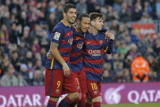 FC Barcelona's Neymar, second left, celebrates with his teammates Luis Suarez, left, and Lionel Messi, right, after scoring against Real Sociedad during a Spanish La Liga soccer match at the Camp Nou stadium in Barcelona, Spain, Saturday, Nov. 28, 2015. (AP Photo/Manu Fernandez)