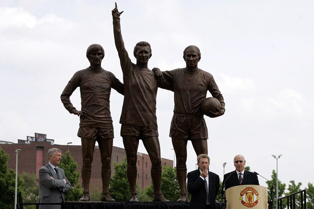 Ex-Manchester United players Bobby Charlton, bottom right and Denis Law, bottom 2nd right, watched by Manchester manager Alex Ferguson, bottom left, speak, after the unveiling of the new statues of left to right, George Best, Denis Law and Bobby Charlton called