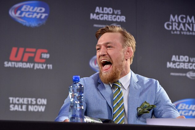 DUBLIN, IRELAND - MARCH 31:  UFC featherweight title challenger Conor 'The Notorious' McGregor of Ireland laughs at UFC Featherweight Champion Jose Aldo during the UFC 189 World Championship Fan Event on March 31, 2015 in Dublin, Ireland. (Photo by Jeff Bottari/Zuffa LLC/Zuffa LLC via Getty Images)