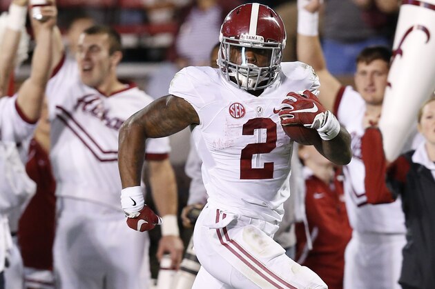 Alabama running back Derrick Henry (2) looks across the field for any Mississippi State defenders on his way to a 65-yard touchdown during the second half of an NCAA college football game in Starkville, Miss., Saturday, Nov. 14, 2015. No. 3 Alabama won 31-6. (AP Photo/Rogelio V. Solis)