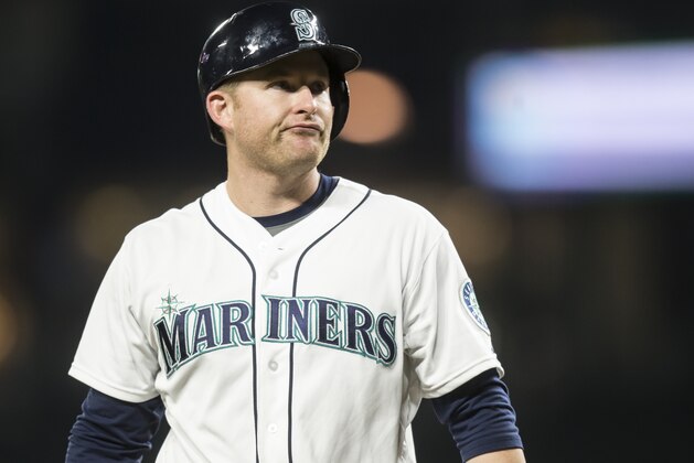 Seattle Mariners' Mark Trumbo walks off the field after an at-bat during a baseball game against the Houston Astros, Wednesday, Sept. 30, 2015, in Seattle. The Astros won the game 7-6. (AP Photo/Stephen Brashear)