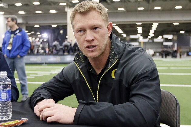 Oregon offensive coordinator Scott Frost responds to questions during media day for the NCAA college football playoff championship, Saturday, Jan. 10, 2015, in Dallas. (AP Photo/Tony Gutierrez)