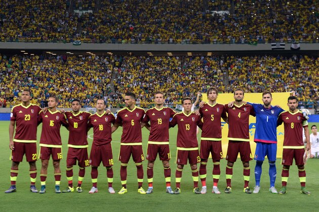 Venezuela's players pose for pictures before their Russia 2018 FIFA World Cup South American Qualifiers football match against Brazil, at the Estadio Castelao stadium in Fortaleza, Brazil, on October 13, 2015. (L-R) Jose Rondon,Roberto Rosales, Ronald Vargas, Alejandro Guerra, Gabriel Cichero, Christian Santos, Luis Seijas, Arquimedes Figuera, Oswaldo Vizcarrondo, Alain Baroja and Tomas Rincon.    AFP PHOTO / EVARISTO SA        (Photo credit should read EVARISTO SA/AFP/Getty Images)