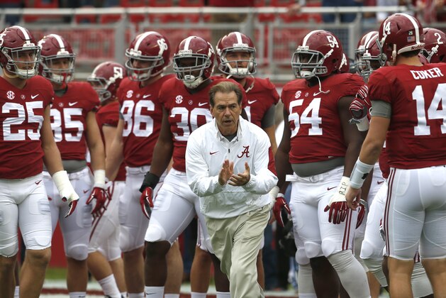 Alabama head coach Nick Saban leads the team onto the field for warmups in an NCAA football game, Saturday, Nov. 21, 2015, in Tuscaloosa, Ala. (AP Photo/Butch Dill)