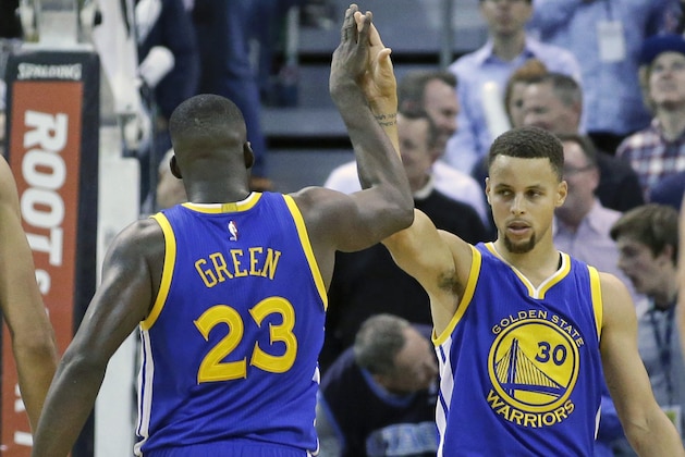 Golden State Warriors' Draymond Green (23) high-fives Golden State Warriors guard Stephen Curry (30) in the second half during an NBA basketball game against the Utah Jazz Monday, Nov. 30, 2015, in Salt Lake City. Warriors won 106-103. (AP Photo/Rick Bowmer)