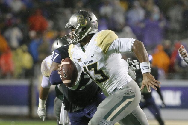 Baylor quarterback Chris Johnson (13) scrambles out of the pocket during the first half of an NCAA college football game against TCU, Friday, Nov. 27, 2015, in Fort Worth, Texas. (AP Photo/Tony Gutierrez)