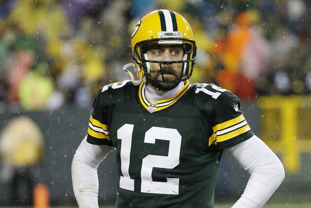 Green Bay Packers' Aaron Rodgers walks off the field after failing to complete on fourth down in the final seconds of an NFL football game against the Chicago Bears Thursday, Nov. 26, 2015, in Green Bay, Wis. The Bears won 17-13. (AP Photo/Morry Gash)