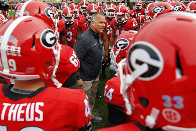 Georgia head coach Mark Richt talks to his team before a game against Georgia Tech of an NCAA college football game Saturday, Nov. 28, 2015, in Atlanta. (AP Photo/Brett Davis)