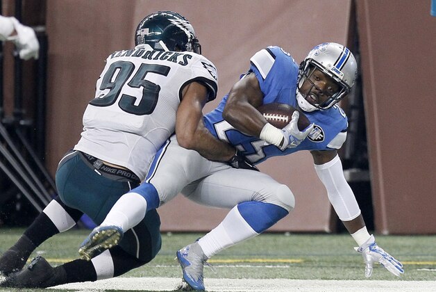 Detroit Lions running back Theo Riddick (25) is tackled by Philadelphia Eagles inside linebacker Mychal Kendricks (95) after making a first down reception during the first half of an NFL football game Thursday, Nov. 26, 2015, in Detroit. (AP Photo/Duane Burleson)