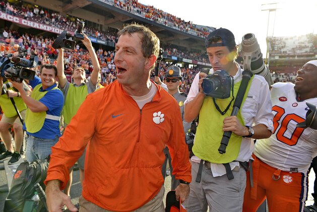 Clemson head coach Dabo Swinney celebrates with the fans after an NCAA college football game against South Carolina Saturday, Nov. 28, 2015, in Columbia, S.C. Clemson won 37-32. (AP Photo/Richard Shiro)
