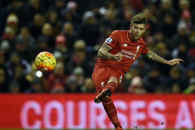 Liverpool's Spanish defender Alberto Moreno takes a freekick during the English Premier League football match between Liverpool and Swansea City at the Anfield stadium in Liverpool, north-west England on November 29, 2015.    / AFP / PAUL ELLIS        (Photo credit should read PAUL ELLIS/AFP/Getty Images)