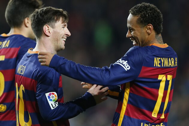 FC Barcelona's Lionel Messi, left, is congratulated by his teammate Neymar, after scored during a Spanish La Liga soccer match against Real Sociedad at the Camp Nou stadium in Barcelona, Spain, Saturday, Nov. 28, 2015. (AP Photo/Manu Fernandez)