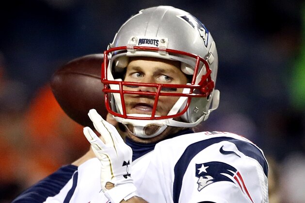 New England Patriots quarterback Tom Brady (12) warms up prior to an NFL football game against the Denver Broncos, Sunday, Nov. 29, 2015, in Denver. (AP Photo/Joe Mahoney)