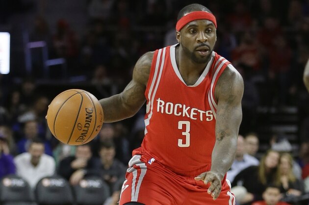 Houston Rockets guard Ty Lawson (3) controls the ball during the second half of an NBA basketball game against the Detroit Pistons, Monday, Nov. 30, 2015, in Auburn Hills, Mich. (AP Photo/Carlos Osorio)
