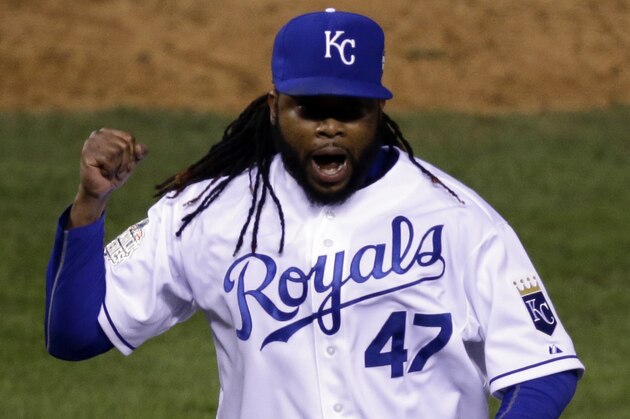 Kansas City Royals pitcher Johnny Cueto (47) celebrates the end of the top of the eighth inning of Game 2 of the Major League Baseball World Series against the New York Mets Wednesday, Oct. 28, 2015, in Kansas City, Mo.  (AP Photo/David Goldman)