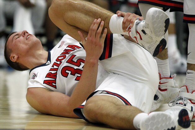 Arizona center Kaleb Tarczewski (35) reacts after an injury during the second half of an NCAA college basketball game against Santa Clara in the quarterfinals of the Wooden Legacy tournament in Fullerton, Calif., Thursday, Nov. 26, 2015. Arizona won 75-73 in overtime. (AP Photo/Alex Gallardo)
