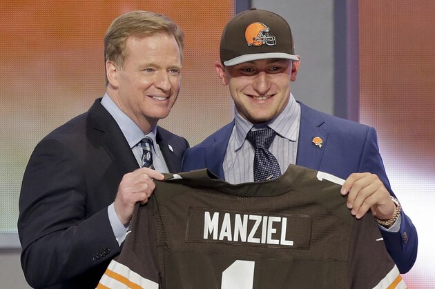 Texas A&M quarterback Johnny Manziel poses with NFL commissioner Roger Goodell after being selected by the Cleveland Browns as the 22nd pick in the first round of the 2014 NFL Draft, Thursday, May 8, 2014, in New York.  (AP Photo/Frank Franklin II)