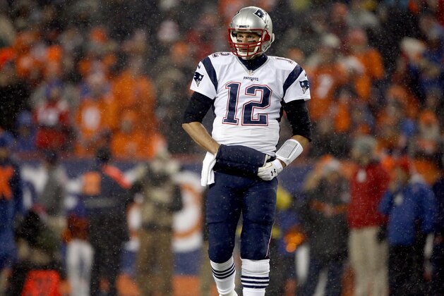 New England Patriots quarterback Tom Brady (12) walks onto the field during the first half of an NFL football game against the Denver Broncos, Sunday, Nov. 29, 2015, in Denver. (AP Photo/Joe Mahoney)