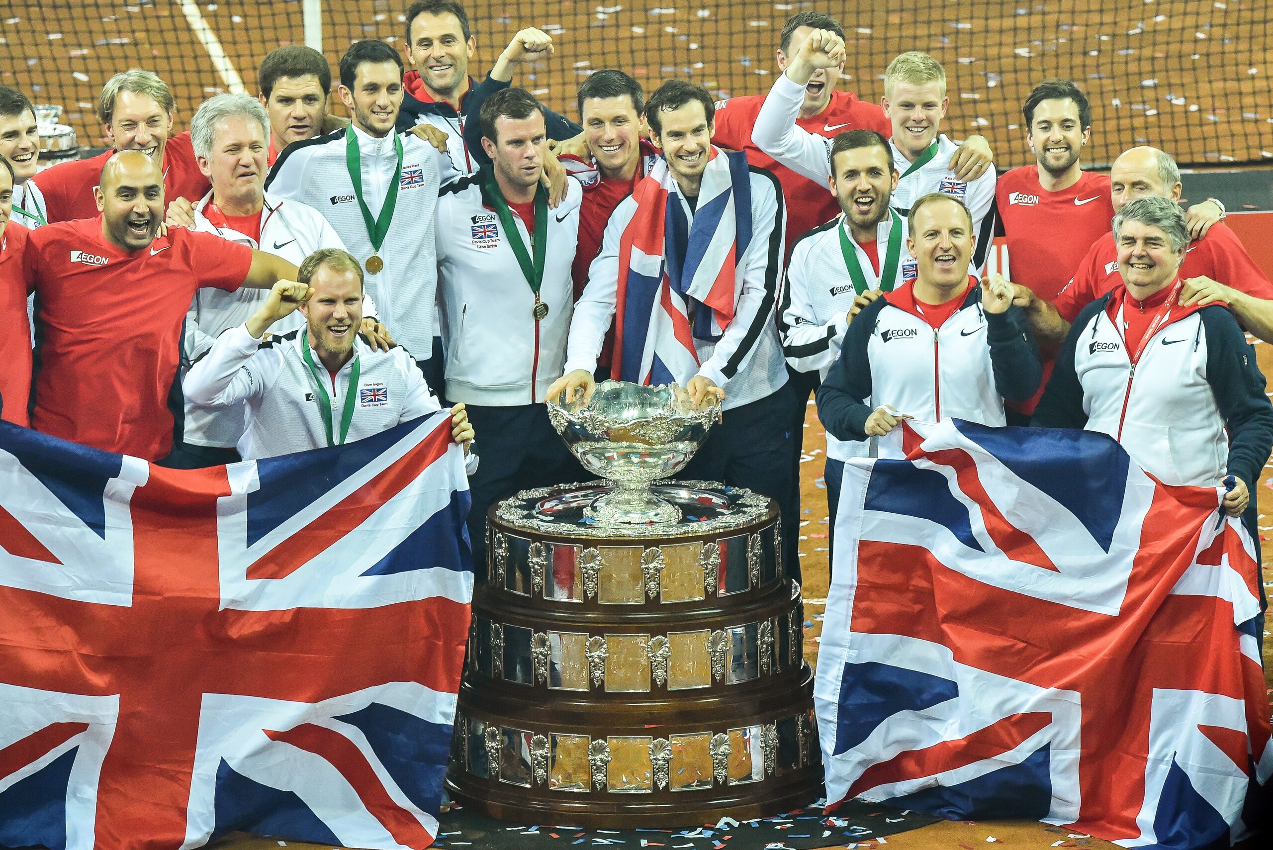Britain's Jamie Murray (TOP, L), Britain's James Ward (TOP, 4-L), Britain's Dominic Inglot (Bottom, L), Britain's captain Leon Smith (C-L), Britain's Andy Murray (C-R), Britain's Kyle Edmund (TOP, 3-R) and Britain's Daniel Evans (BOTTOM, 3-R) pose with other team members and the trophy after winning the Davis Cup tennis final against Belgium at Flanders Expo on November 29, 2015 in Ghent. Britain won the Davis Cup for the first time in 79 years in Ghent on Sunday when Andy Murray defeated David Goffin 6-3, 7-5, 6-3, in the first of the reverse singles for an unbeatable 3-1 lead over Belgium. AFP PHOTO / PHILIPPE HUGUEN / AFP / PHILIPPE HUGUEN (Photo credit should read PHILIPPE HUGUEN/AFP/Getty Images) Britain's Jamie Murray (TOP, L), Britain's James Ward (TOP, 4-L), Britain's Dominic Inglot (Bottom, L), Britain's captain Leon Smith (C-L), Britain's Andy Murray (C-R), Britain's Kyle Edmund (TOP, 3-R) and Britain's Daniel Evans (BOTTOM, 3-R) pose with other team members and the trophy after winning the Davis Cup tennis final against Belgium at Flanders Expo on November 29, 2015 in Ghent. Britain won the Davis Cup for the first time in 79 years in Ghent on Sunday when Andy Murray defeated David Goffin 6-3, 7-5, 6-3, in the first of the reverse singles for an unbeatable 3-1 lead over Belgium. AFP PHOTO / PHILIPPE HUGUEN / AFP / PHILIPPE HUGUEN (Photo credit should read PHILIPPE HUGUEN/AFP/Getty Images)