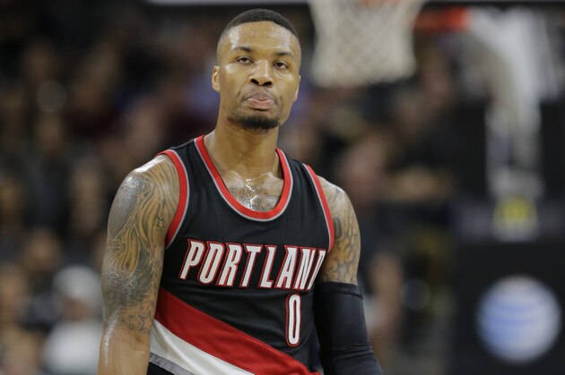Portland Trail Blazers' Damian Lillard (0) walks off the court during the second half of an NBA basketball game against the San Antonio Spurs, Monday, Nov. 16, 2015, in San Antonio. San Antonio Spurs won 93-80. (AP Photo/Eric Gay)