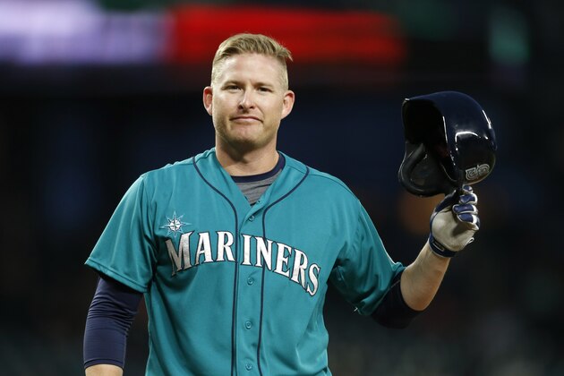 Seattle Mariners' Mark Trumbo walks to the dugout after batting during a baseball game against the Los Angeles Angles on Friday, July 10, 2015, in Seattle. (AP Photo/John Froschauer)