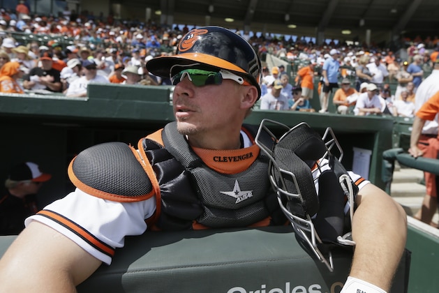 Baltimore Orioles catcher Steve Clevenger waits in the dugout before the first inning of a spring training exhibition baseball game against the Tampa Bay Rays in Sarasota, Fla., Saturday, March 14, 2015. (AP Photo/Carlos Osorio)